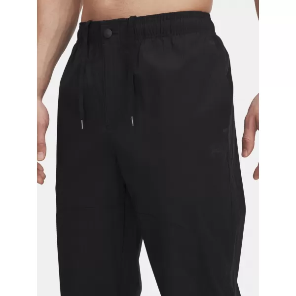  Muške sportske hlače UNDER ARMOUR UA UNSTPBLE WOVEN TX TAPER 6003865-001 CRNA 