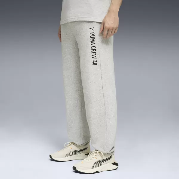  Muške trenirke PUMA M GRAPHIC FRENCH TERRY JOGGER 52770304 SVIJETLOSIVI VRIJESAK 
