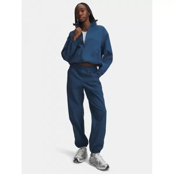  Ženske trenirke UNDER ARMOUR UNSTOPPABLE WVN JOGGER 6011400-498 PLAVA 